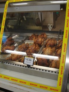 Roast chickens on display at the supermarket