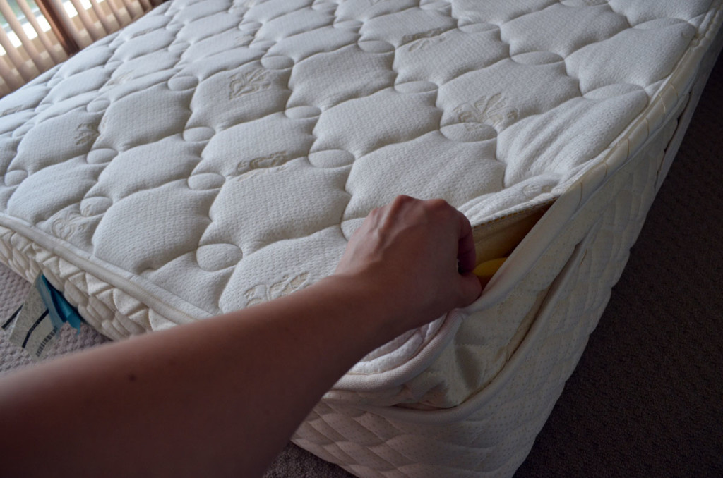 Mattress with the seams unpicked, showing the inside.